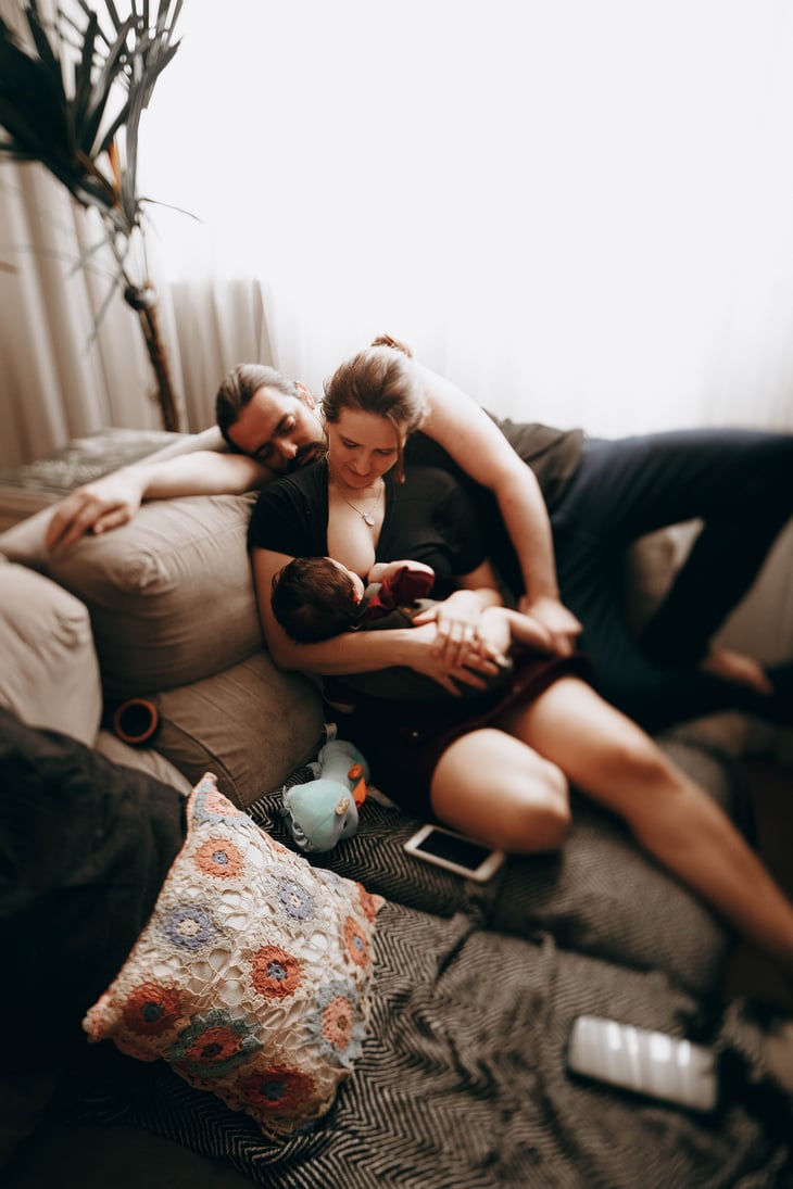 Family with baby on couch